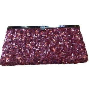 Pink sequence clutch w/plenty of pockets to hold your cards w/sliver push lock